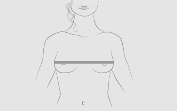 How to measure bust size standing up - wrapping measuring tape around the fullest part of the bust for accurate bra cup size