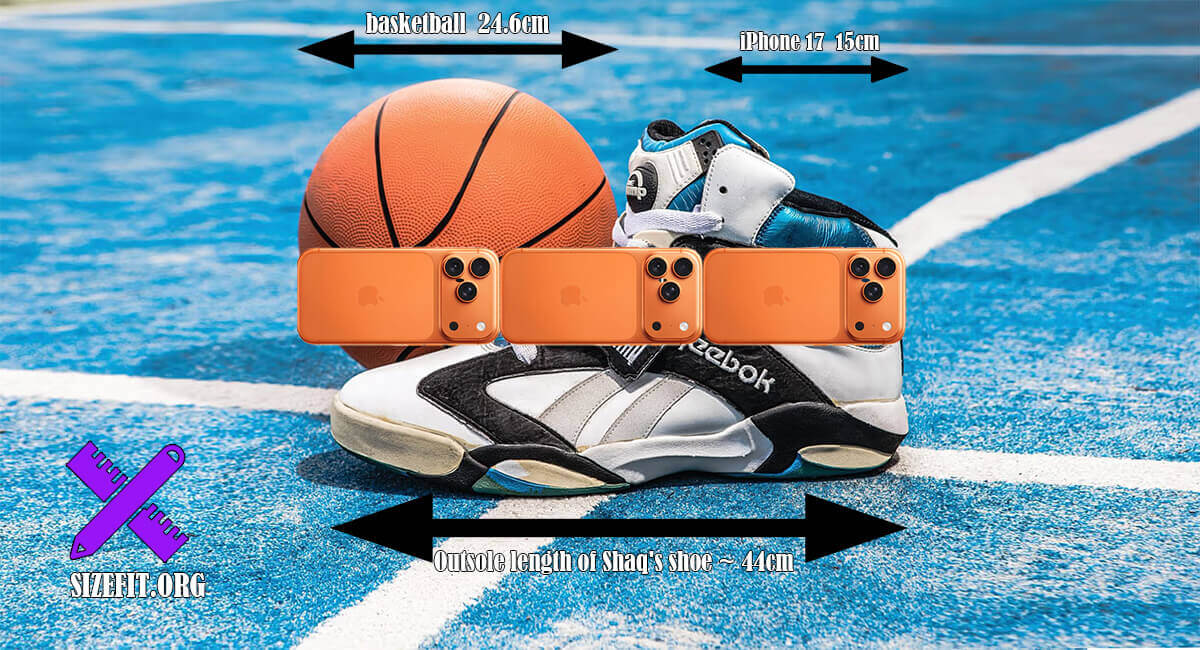 Shaq holding his size 22-23 signature sneakers